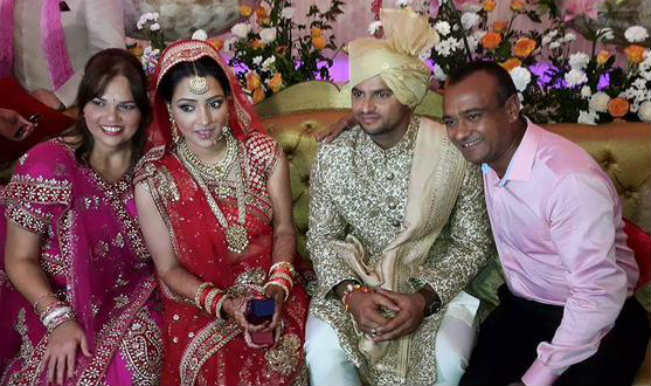 Suresh Raina and Priyanaka Chaudhary with their parents and relatives at their wedding marriage