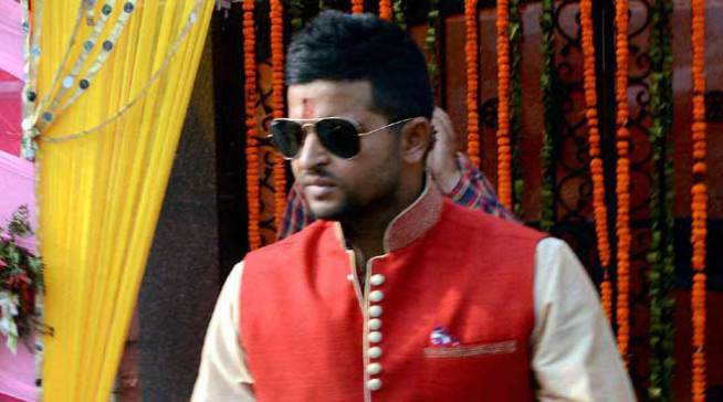 Suresh Raina moving down to wedding marriage venue and a photo images was shot of him leaving his home