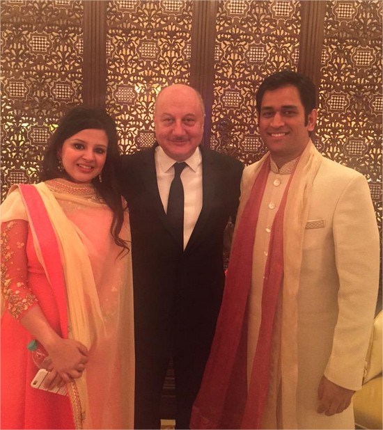 Suresh Raina, MS Dhoni, Anupam Kher, Sakshi posing pose for a marriage pic image and photo