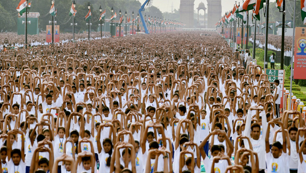 New Delhi: Thousands of participants performing Yoga during the mass yoga session on the International Day of Yoga 2015 at Rajpath in New Delhi on Sunday. PTI Photo by Atul Yadav(PTI6_21_2015_000231A)