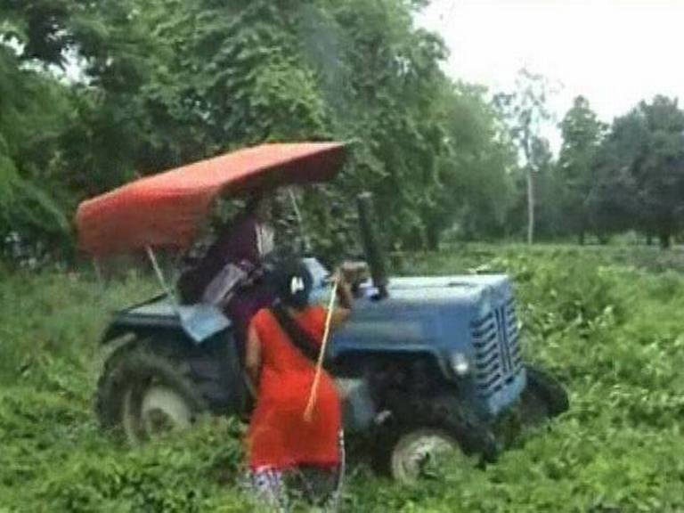 mafia lady with pistol in her saree runs tractor over wife