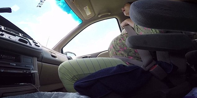 Husband films pregnant wife calmly giving birth AND delivering a 10lb baby in the car as they rush to hospital 