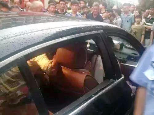 Pic shows: Emergency services trying to save the son inside the car. A woman has incurred the wrath of netizens across the country after she refused to allow firefighters to break her car window to save her trapped son because the vehicle was too expensive. After her three-year-old son became stranded in the back of her BMW, the unnamed mother from Yiwu city in east China’s Zhejiang Province stunned onlookers when she told firefighters not to break the car window to rescue the boy. Reports said the BMW had locked itself, with the mother unable to open the car door. The trapped boy was heard crying inside the hot vehicle and clawing at the window. However, instead of allowing rescuers to break the glass, the mother said she wanted to wait for a locksmith instead, so as not to damage her expensive car. Firefighters finally took the initiative several minutes later when the boy began to faint inside the oxygen-deprived car. They smashed in the window and rescued the boy. One of the firefighter was quoted as saying: "It’s very dangerous to leave children inside cars, especially in such heat. It can threaten a child’s life in a short time." Netizens took to various social media platforms to criticise the mother, with one netizen saying: "It looks like the car is her real son." Another netizen said: "The mother shouldn’t have left her kid in the car in the first place. Even if the car did accidentally lock itself. What happens if someone breaks the window and abducts the kid?" (ends)