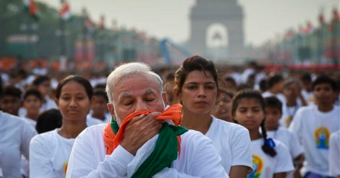 s Prime Minister Narendra Modi was busy performing asanas during the grand celebration of International Yoga day, some of his post-asana activities have now dragged him into a controversy. He has been accused of insulting the national flag by a social worker of Pondicherry, who has lodged a complaint against Modi for wiping his face using the tricolour scarf he was wearing. Requesting the police to conduct an inquiry, the complainant sought to register a case against Modi under the Prevention of Dishonour to National Flag Act. 