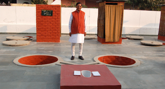 Bindeshwar-Pathak-with-his-two-pit-Indian-latrine-model