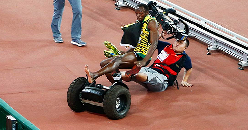 Usain Bolt Wiped Out By Cameraman On Segway When Celebrating 200m Gold At Beijing 2015