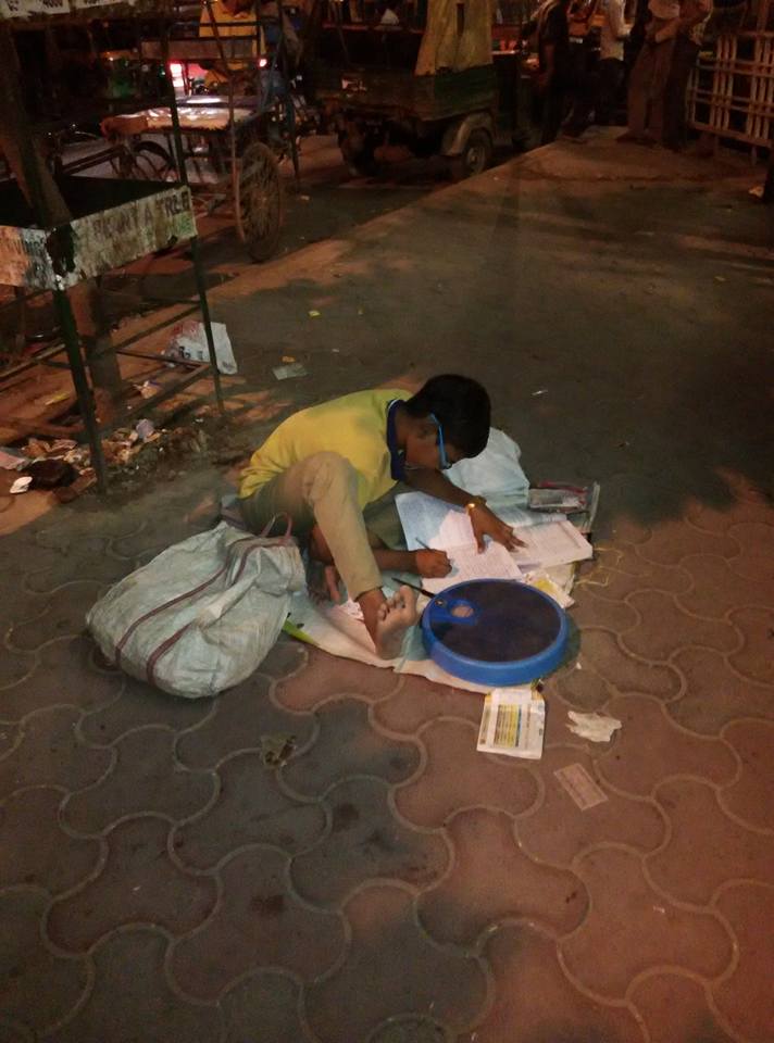Little Boy Sits Outside a Metro Station with a Weighing Machine to Make Money for His Education
