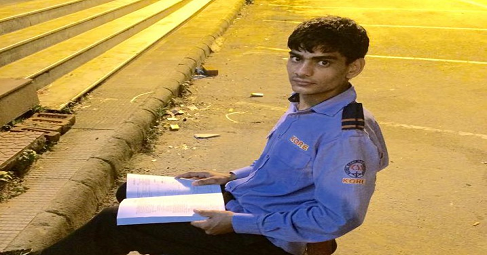 Student studying under street lights in Haryana