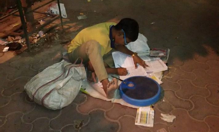 harnedra singh of noida sprawled over a pile of copies (note books) shared the story in facebook