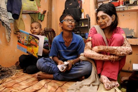 Harendra Singh(in spectacles) at his one-house in a a village in Noida