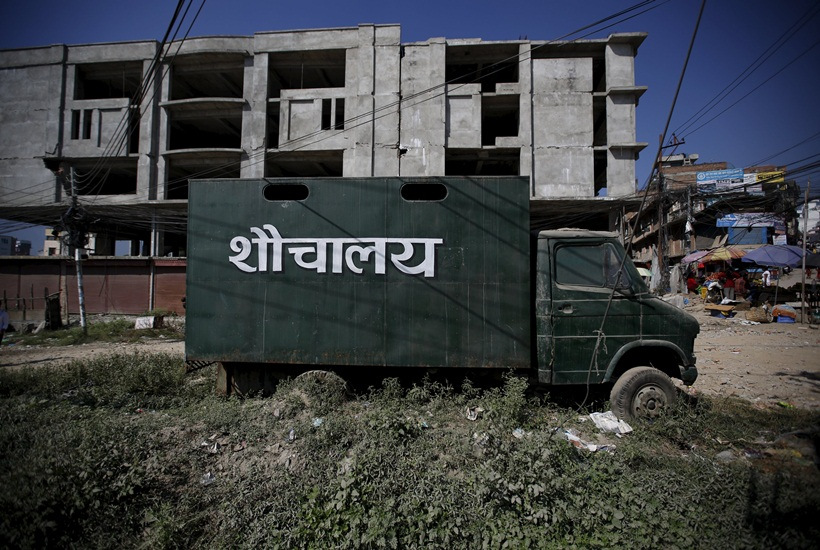 A mobile toilet is parked on a road in Kathmandu, Nepal