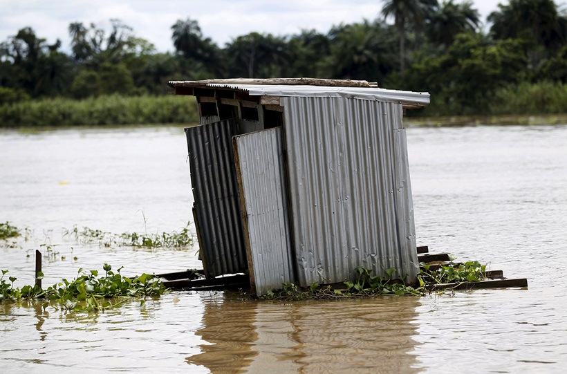 A toilet floats on the river Nun near Yenagoa, Bayelsa state in Nigeria's delta region October 8, 2015. 