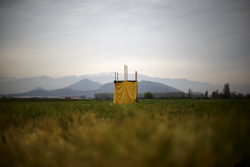 A toilet stands in the middle of an empty field on the outskirts of Santiago, Chile, October 8, 2015 