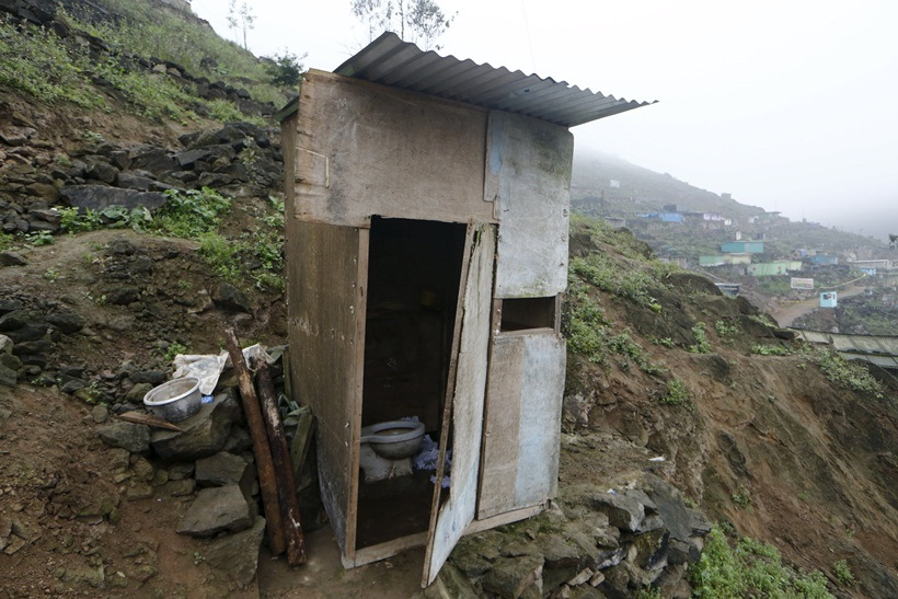 A toilet stands outside the Llamocca family home at Villa Lourdes in Villa Maria del Triunfo on the outskirts of Lima