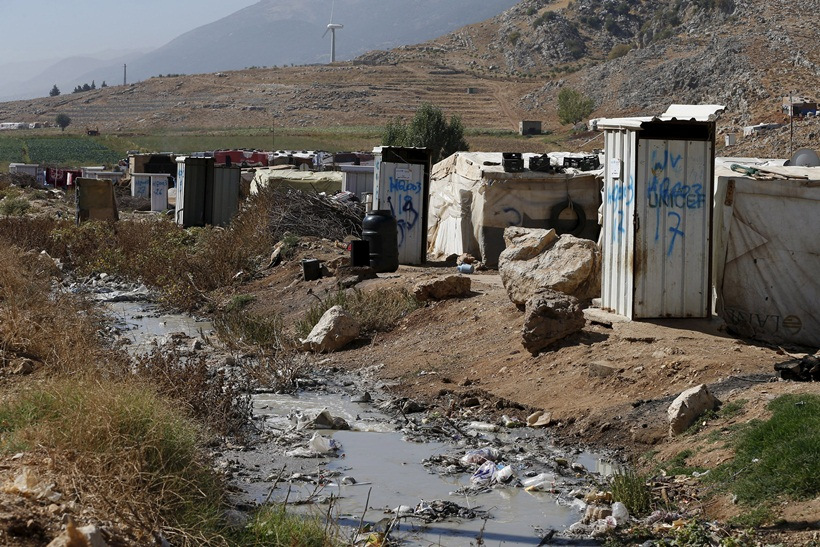  Toilets donated by Unicef and World Vision stand near tents at a Syrian refugee settlement camp in Qab Elias in the Bekaa Valley, near Baalbek 