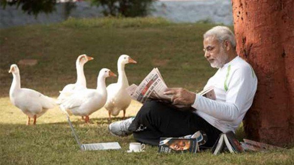 Narendra Modi reading newspaper