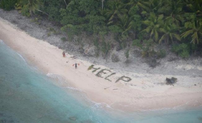 Three Men Were Rescued From A Deserted Island After Writing 'Help' On The Sand (1)