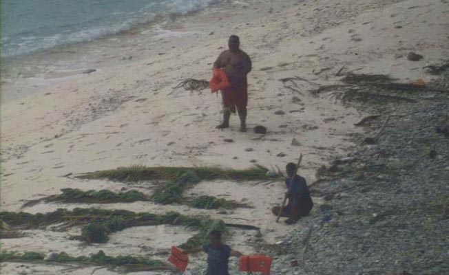 Three Men Were Rescued From A Deserted Island After Writing 'Help' On The Sand (3)