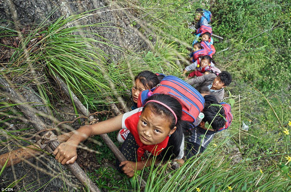 These Children Risk Their Lives Climbing A 2600 Ft Cliff Just to Get to School (3)