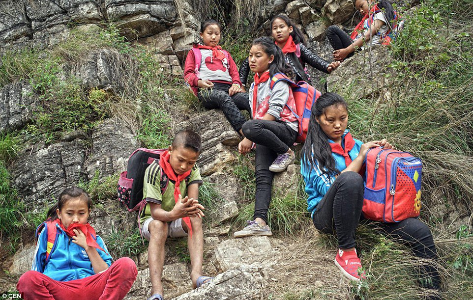 These Children Risk Their Lives Climbing A 2600 Ft Cliff Just to Get to School (5)