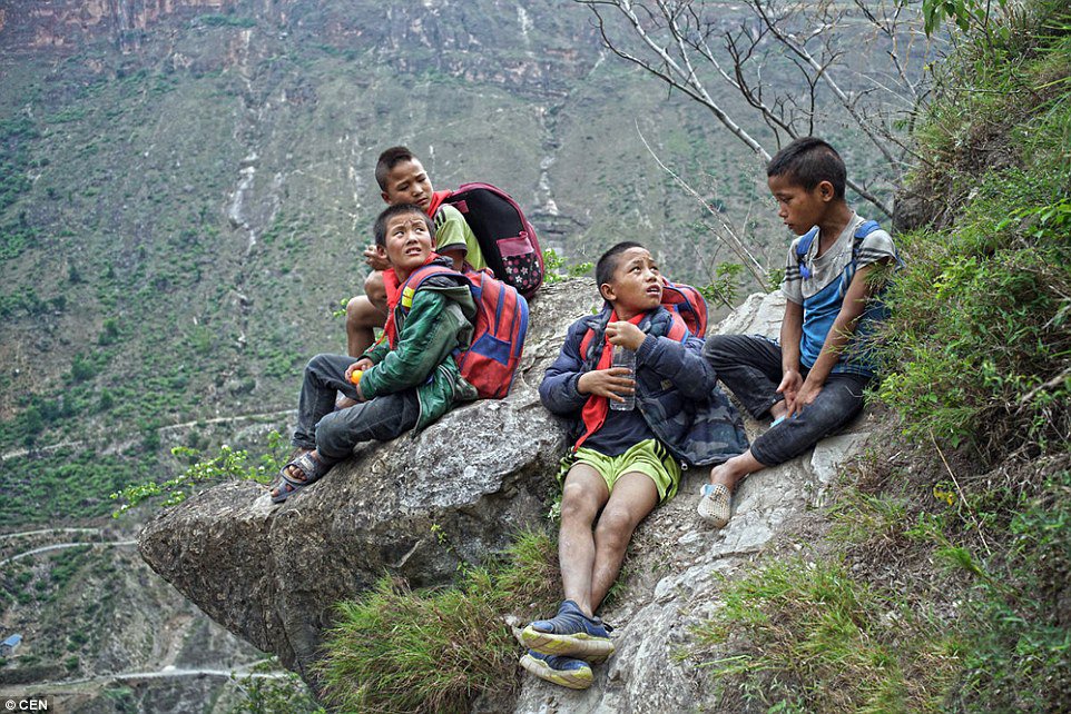 These Children Risk Their Lives Climbing A 2600 Ft Cliff Just to Get to School (9)