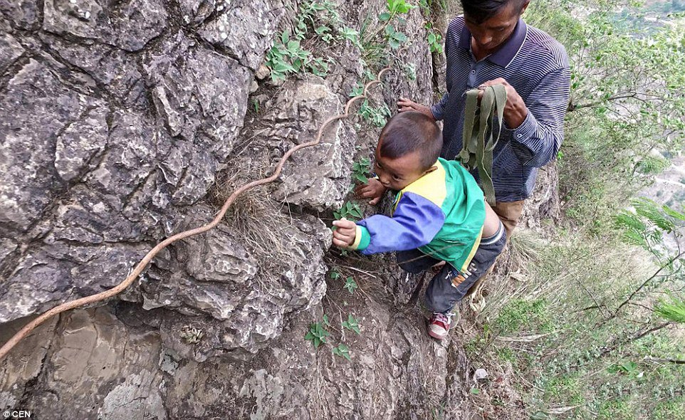 These Children Risk Their Lives Climbing A 2600 Ft Cliff Just to Get to School (6)