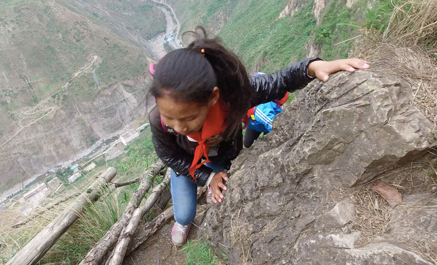 These Children Risk Their Lives Climbing A 2600 Ft Cliff Just to Get to School (12)