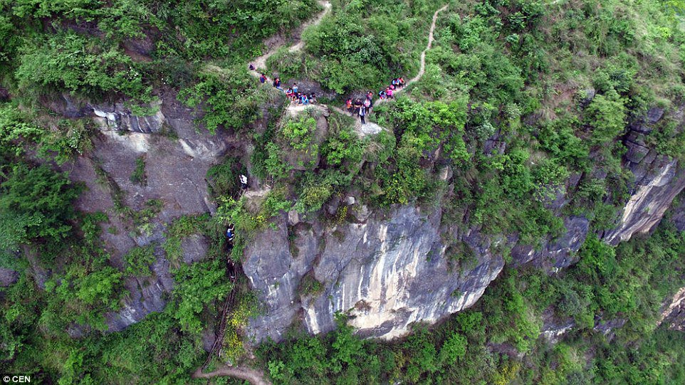 These Children Risk Their Lives Climbing A 2600 Ft Cliff Just to Get to School (8)