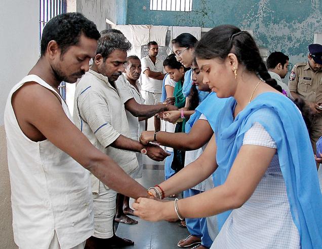 Students tying Rakhi to Prisioners