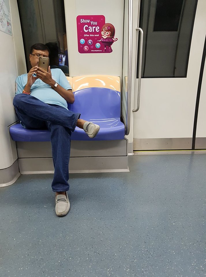 man filming woman on train