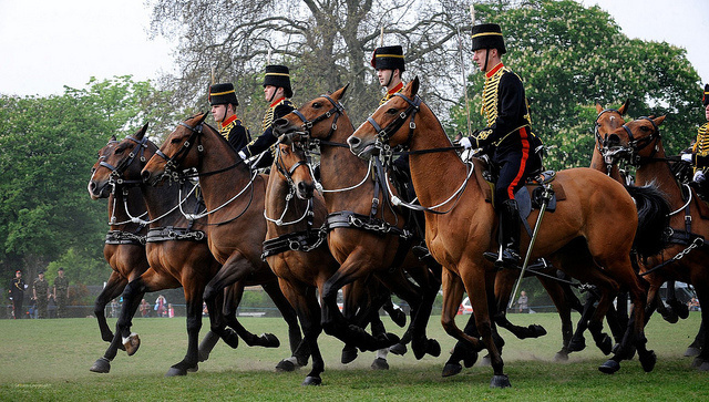 Soldiers mount their horses from left side