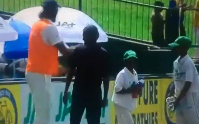 Ishant-Sharma giving fluids to ball boy