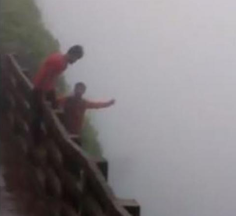 2 revelers fell from cliff
