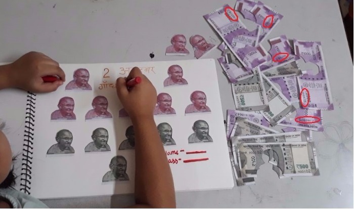 indian-currency-destroyed by little girl