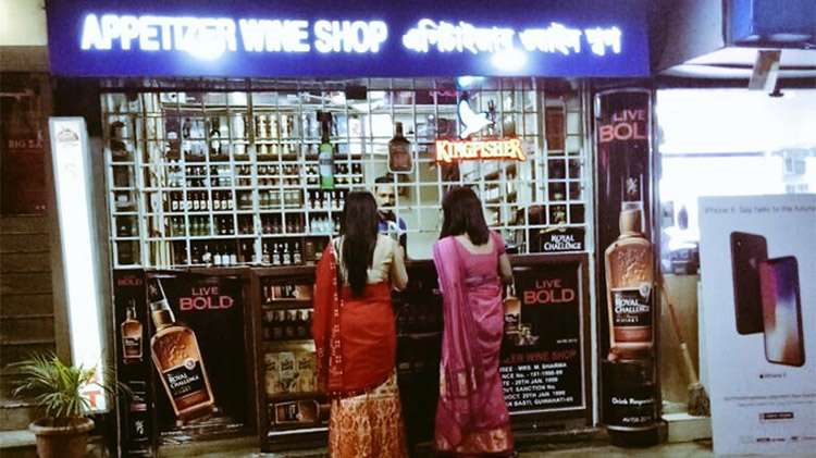 Women buying alcohol
