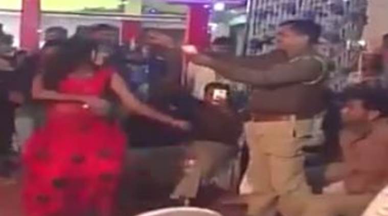police showering money on bar dancer