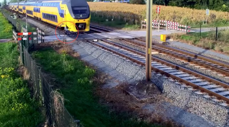 cyclist narrowly escapes death, cyclist, cyclist viral video, cyclist, cyclist narrowly train, cyclist narrowly escapes train