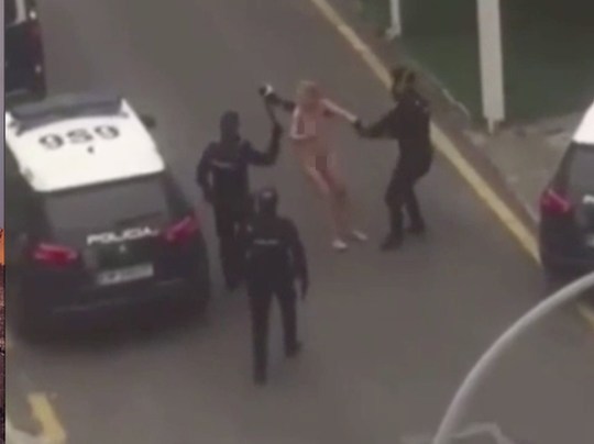 Woman Strips And Jumps On Police Car To Protest Lockdown Measures After 