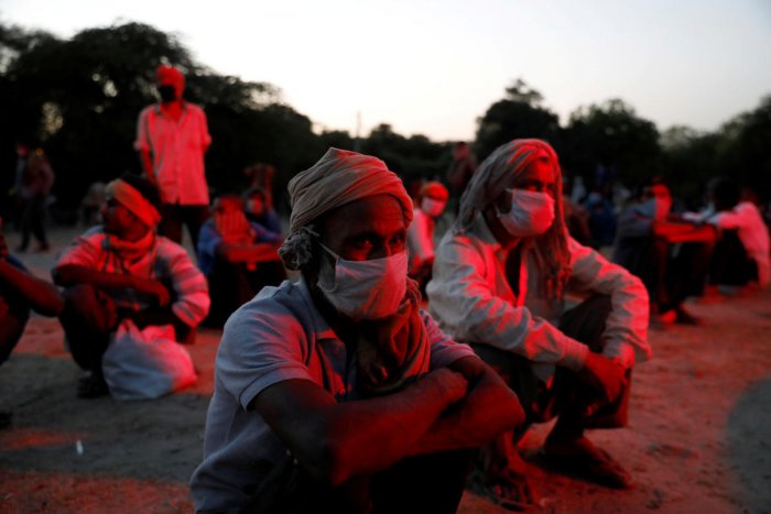 Workers wait for police orders during coronavirus lockdown. 