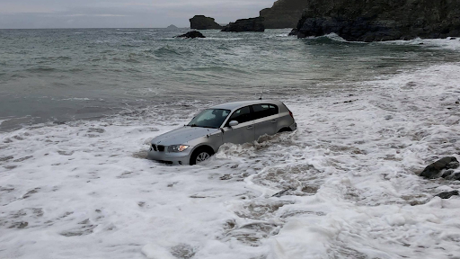 BMW Gets Swept Into The Sea After Being Left Parked On The Beach